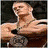 A muscular man with short brown hair appears in multiple poses holding championship belts, one showing "WWE" text.