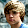 Six of a person with light brown hair in a blue shirt against a blurred background showing subtle facial expression changes from neutral to smiling