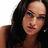 A pixelated image of a woman with long dark hair against a blue background with green text reading SHE IS 5000000 HOTTTTTT.