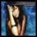 Pixelated static image of a person with long dark hair wearing a black top and pink accents, set against a blue background with gradient effects.