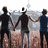 Four pixelated figures stand in a row holding hands against a blurred background with a light-colored object above them.