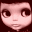 Pixelated doll face with large eyes and pink skin in three expressions: neutral, smiling, and winking against dark background.