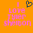 Pixelated orange background with pink text reading "I Love Tyler Shelton" and a blue heart symbol above the text.