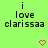 Green background with black pixelated text reading "i love clarissa" and two pink heart icons below the text.