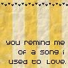 Yellow and white striped background with black text reading 'you remind me of a song i used to love.' at the bottom, black heart symbols along the top edge.