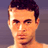 Pixelated static image of a person's upper face and shoulders with dark hair against a solid background.