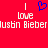 Red background with white text reading "I love Justin Bieber" and a blue pixelated heart symbol above the text.
