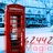 A red telephone booth stands against a blue and white background with pixelated patterns.