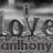 Grayscale pixelated image with large stylized text 'Love' and smaller text 'anthony' below, set against a blurred background.