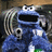 Pixelated blue Cookie Monster with wide eyes and open mouth, surrounded by text reading 'cookie monster has ISSUES' on black background.