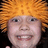 Pixelated image of a person with orange hair and green text on pink background reading DATS ME!