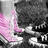 A static image of a person's lower legs and feet wearing pink high-top sneakers with white laces, black soles, and dark pants against a grayscale background.