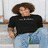 A person with curly brown hair wears a black shirt and light blue jeans across multiple poses, including sitting on steps and leaning forward.