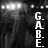 Black-and-white animated contact sheet showing three frames of a buddy icon with text elements and stage lighting effects.