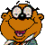 Pixelated orange cartoon character with large round eyes, black eyebrows, and a wide open mouth showing pink tongue, wearing a purple necklace and multicolored patterned clothing.