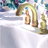 Animated sequence showing a white sink with golden faucet and bottle, water flowing from the tap, and yellow rubber duck appearing in lower-left corner.