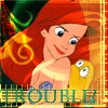 Pixelated cartoon character with red hair and blue top holding yellow fish, standing against colorful background with green swirls and orange patterns.