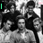 Black-and-white group photograph of multiple people with green text overlays changing between 'Love' and 'Vampires'.