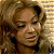 A pixelated image showing a woman with curly blonde hair on the left and green text reading "Original Icons .com" on a dark green background on the right, arranged in a 2x1 contact sheet layout.