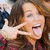 A four- with two celebrity images and text on colored backgrounds, showing a woman making a peace sign and another holding a microphone