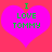 Two identical pink hearts on a red background with green text reading "I LOVE TOMMY" in pixelated font.