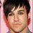 Pixelated portrait of a person with dark hair against a pink background, next to vertical blue text reading 'HE'S HOT' and horizontal blue text reading 'SO' on a blue field.