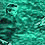 Pixelated figure in dark clothing against teal water background, shifting pose between two states.