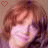 Pixelated image of a person with light brown hair wearing a pink top, two heart symbols in the corners.