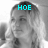 A grayscale image of a person with long hair, showing three sequential text overlays: 'HOE' above the head, 'FO' over the eye, and 'SHO!' over the mouth.