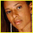 repeated pixelated images of a person with dark hair and light skin, overlaid with horizontal text reading "shavonda" in brown and white