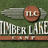 A static buddy icon split into two sections: left shows a brown circular emblem with 'TLC' over gray wings and 'TIMBER LAKE' text, right displays white pixelated text on green background reading 'Bunk 13 2007 Always & Forever'.