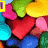 Pixelated candy-themed icon with colorful heart-shaped and round candies, yellow text reading 'love' and 'CANDY!!!', and a small purple number '1' in the top-left corner.