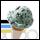 Pixelated static image of a stylized figure with dark green hair, light skin tone, and visible facial features including eyes and mouth.