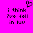 A static pixel art image with a bright pink background, black text reading "i think i've fell in luv," and a small heart symbol above the text.