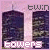 Pixelated image of two dark towers against a pink sky with 'twin' text above and 'towers' below, showing animation change in the top-right text.