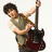 Pixelated image of a person holding a red electric guitar, with text reading "that was so not Nick Jonas" and "OMG!" on black background.