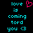 Pixelated cyan text on black background reads 'love is coming tord you <3' with a pink heart symbol replacing the word 'toward'.