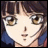 Pixelated anime-style face with brown eyes and dark hair, next to stylized text on black background.