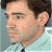 A 48x48 pixel buddy icon featuring a side-profile of a man with dark hair and light skin wearing a white shirt, alongside green text reading "Original Icons .com" on a solid green background.