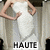 A static image of a person in a white dress with arms raised, displaying text below the figure.