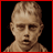 A 48x48 pixel animated contact sheet showing two frames: a pixelated child's face on the left and red stylized text 'Korn' on the right against black backgrounds with red borders.