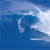 Static pixelated image of a blue ocean wave with white foam crest, rendered in low-resolution 256x256 pixels.