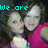 Two people in pink tops pose closely together with text overlays changing across frames.