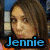 A pixelated image of a person with long brown hair wearing an orange top, with the name 'Jennie' overlaid in blue text.