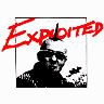 A static image of a person with a mohawk, wearing sunglasses and a dark jacket under red text reading "EXPLOITED" on white background.