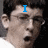 A four- shows a person with dark hair and glasses in sequential text overlays: 'I', 'AM', 'Mclovin.', and an empty