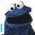 Blue furry monster with large white eyes and black pupils, open mouth showing dark interior, displayed in four with text overlays
