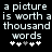 A black background displays white pixelated text reading 'a picture is worth a thousand words' with five small plus signs below, where the third sign changes from gray to white.