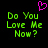 Green pixelated text 'Do You Love Me Now?' on black background with pink heart symbol above text.