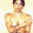 Static pixelated image of a shirtless male figure with dark hair and muscular build against light background.